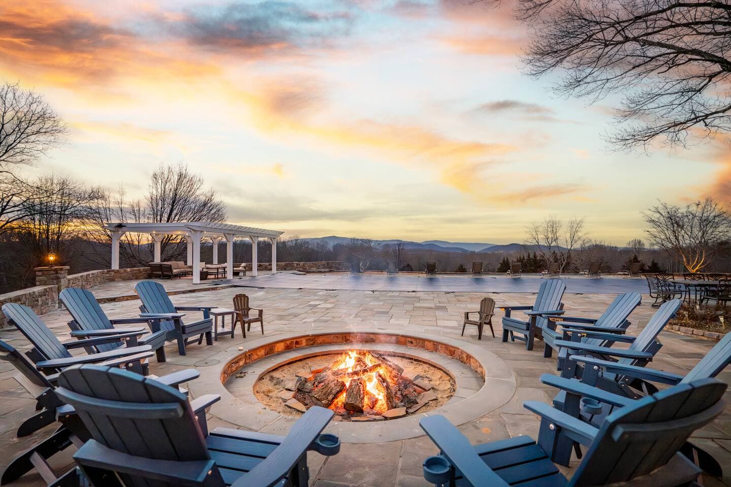 Firepit seating with mountain views at sunset
