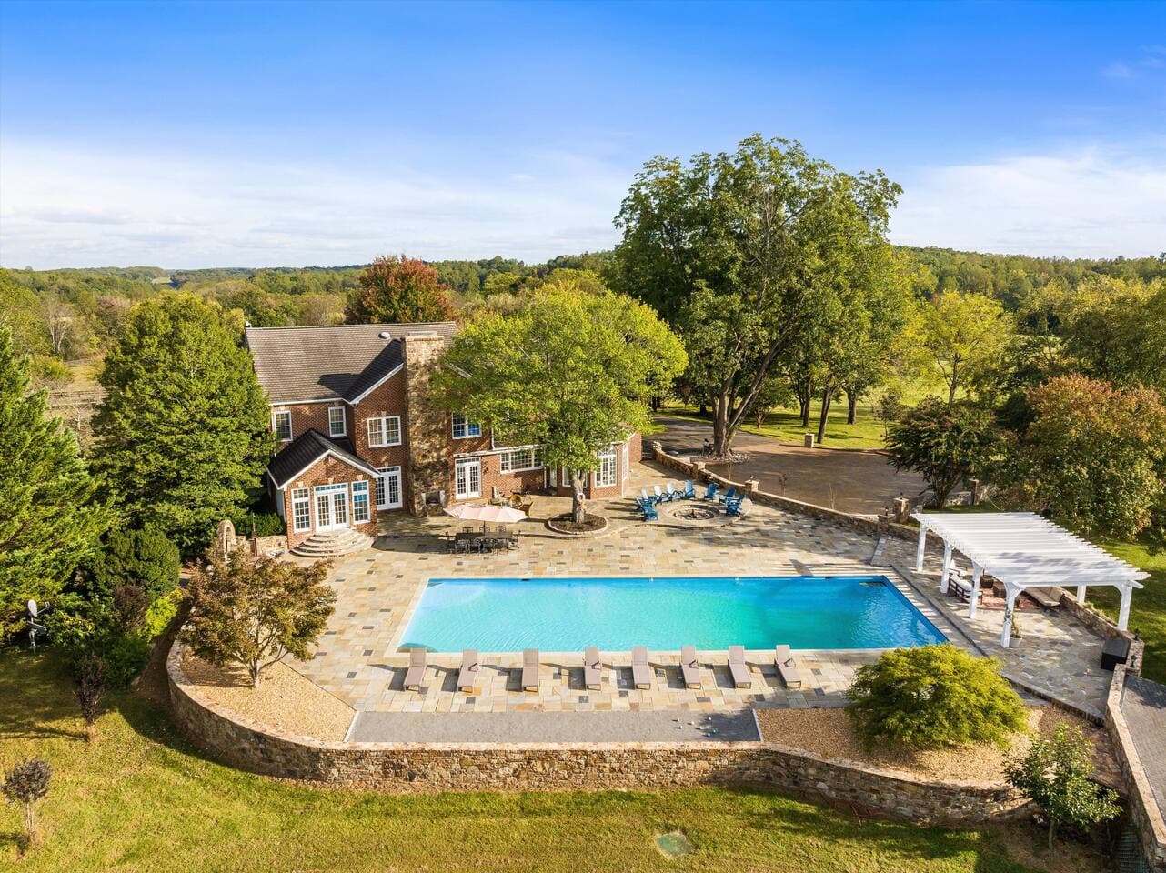 Aerial view of the pool terrace and house at Mountain Mama Ranch